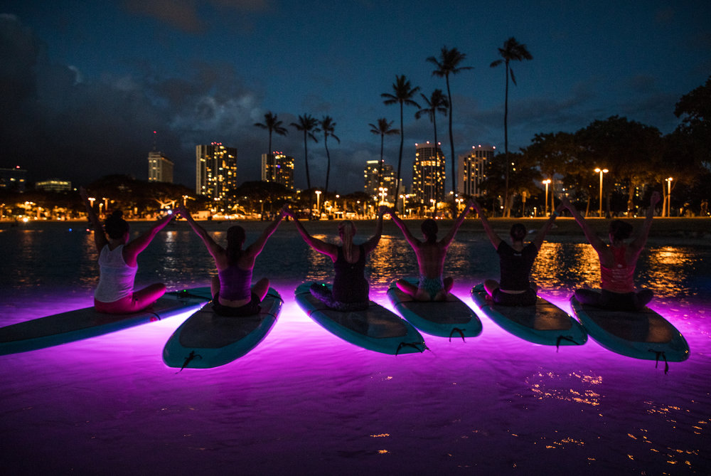yoga floats sup glow purple oahu hawaii