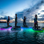 yoga floats oahu hawaii night ocean glow
